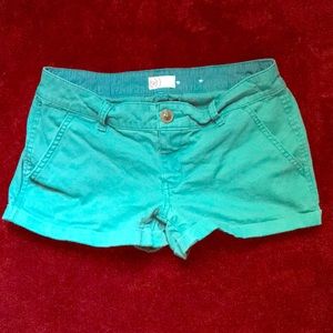 Turquoise jean shorts.